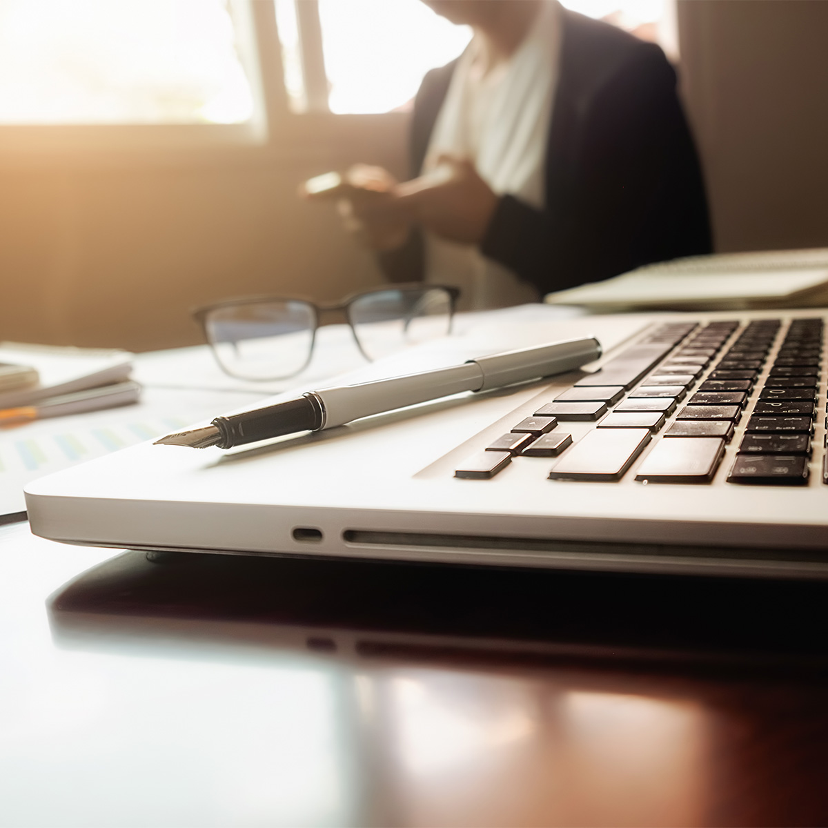 business-concept-with-copy-space-office-desk-table-with-pen-focus-analysis-chart-computer-notebook-cup-coffee-desk-vintage-tone-retro-filter-selective-focus